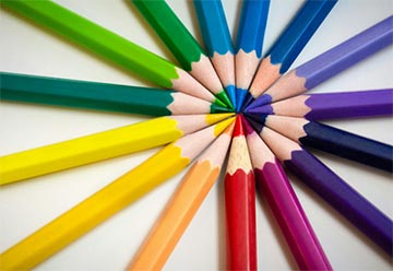 Colored pencils making a circular rainbow