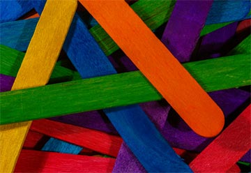 A pile of different colored popsicle sticks