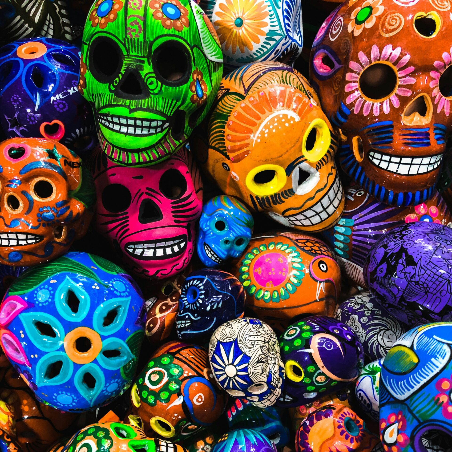 An abundance of colorful painted skulls.