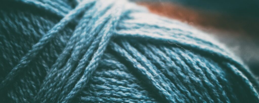 Close up of a teal ball of yarn