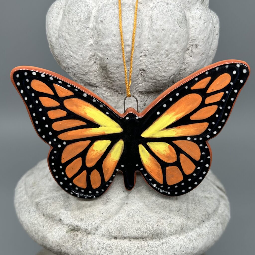 A clay monarch butterfly ornament.