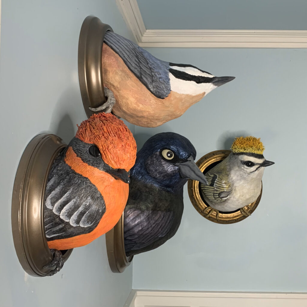 Four bird sculptures from Julia Kemerer's Portals series.