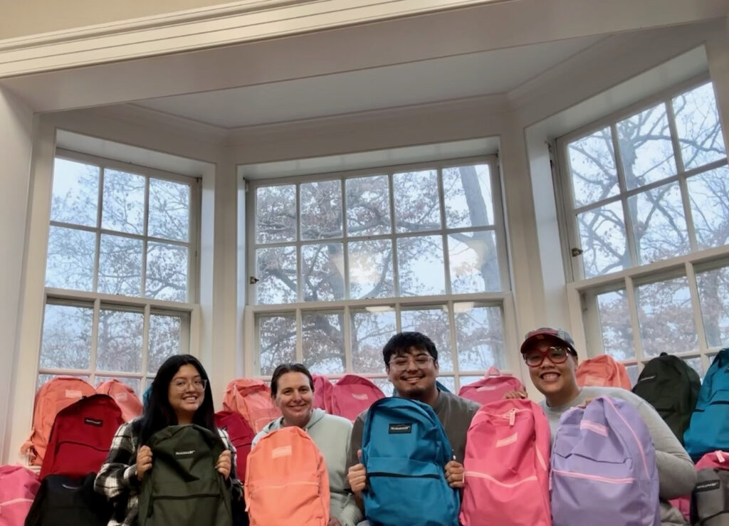 Staff members Abbey Castro, Jes Klinge, Eddie Flores, and Ashley Cullen - Williams pack NEST packs at Brushwood.