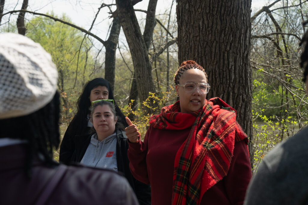 Ashley Cullen-Williams leads the group in the woods.